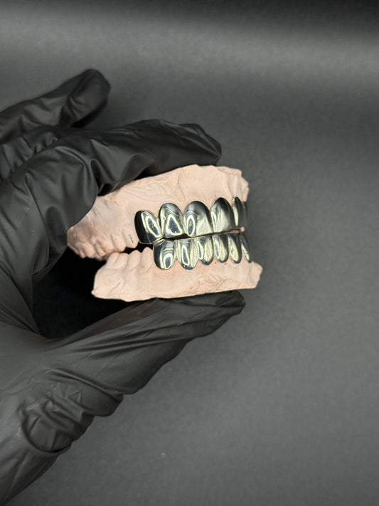 Close-up of custom handmade grillz showing polished finish and precision fit