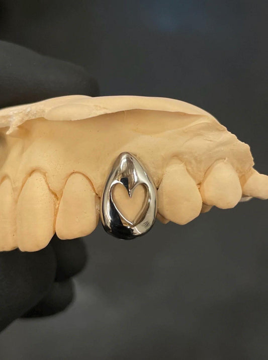 Gold/Silver Grillz with Hollow Heart Shape – Stylish Custom Dental Jewelry