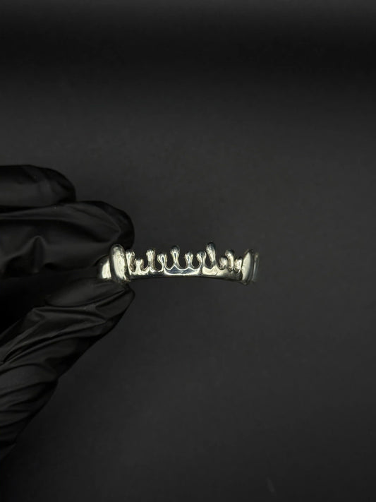 Close-up of Custom Dripped Style Sterling Silver Grillz showing handcrafted drip details and polished finish