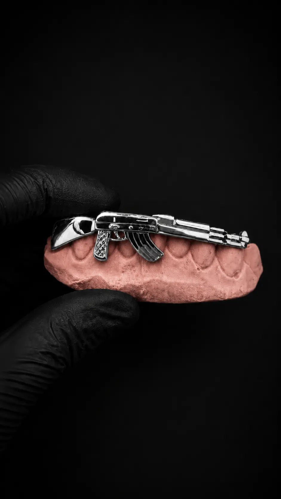 Custom AK-47 grillz in sterling silver and gold with precision CAD design on dental mold