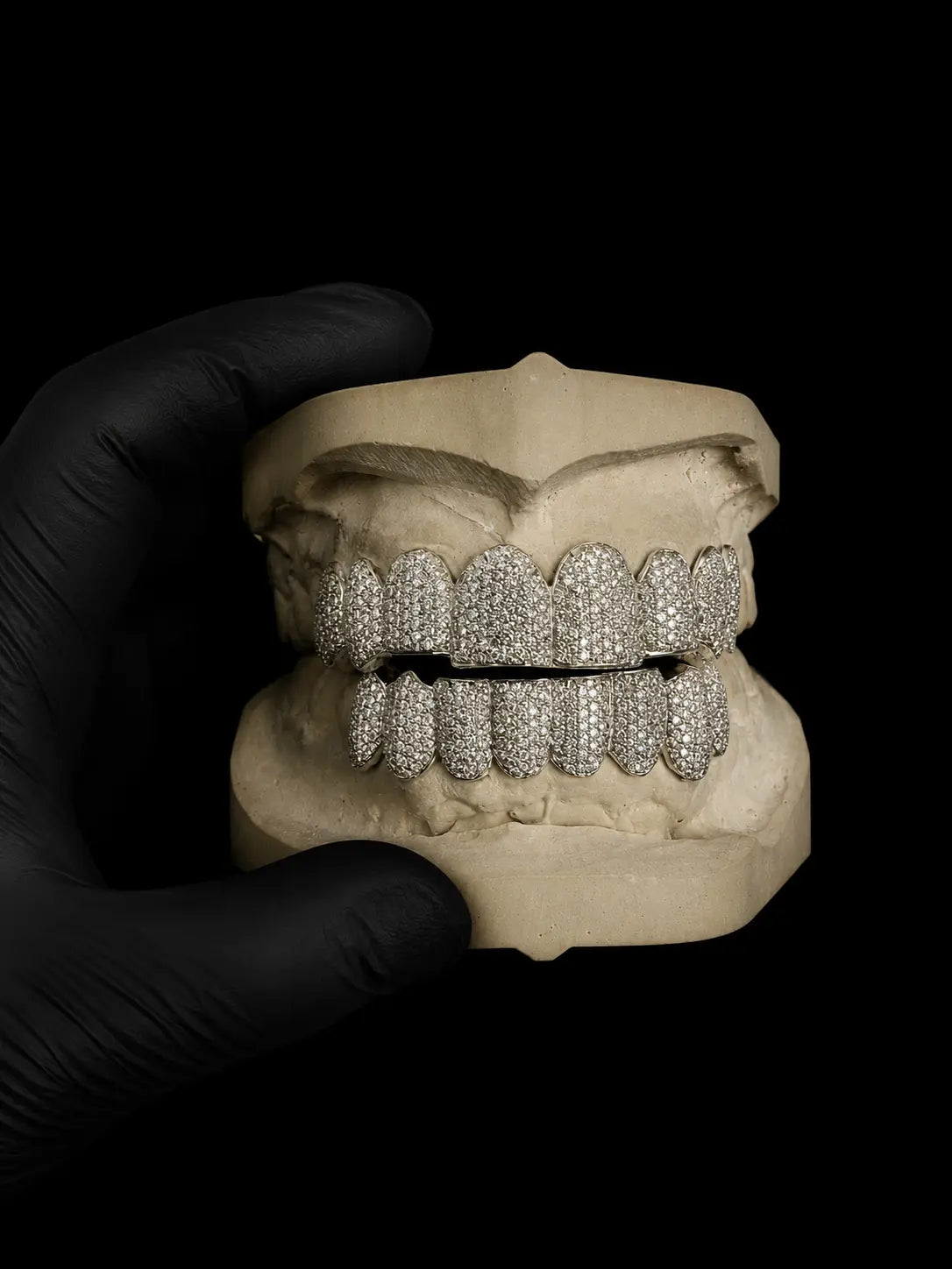 Front view of custom bustdown grillz with hand-set VVS-Moissanite