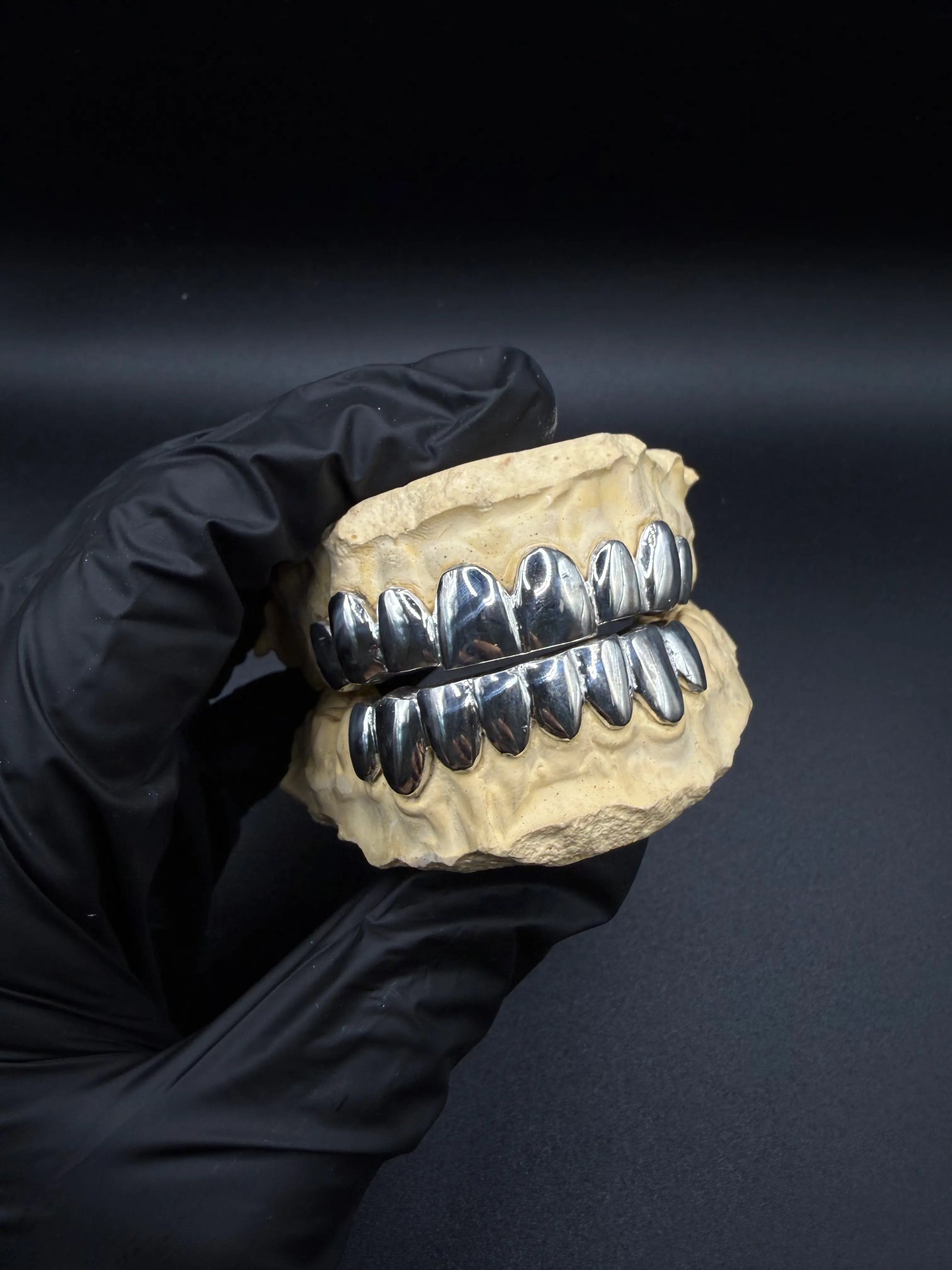 Top view of custom handmade grillz in solid gold or silver