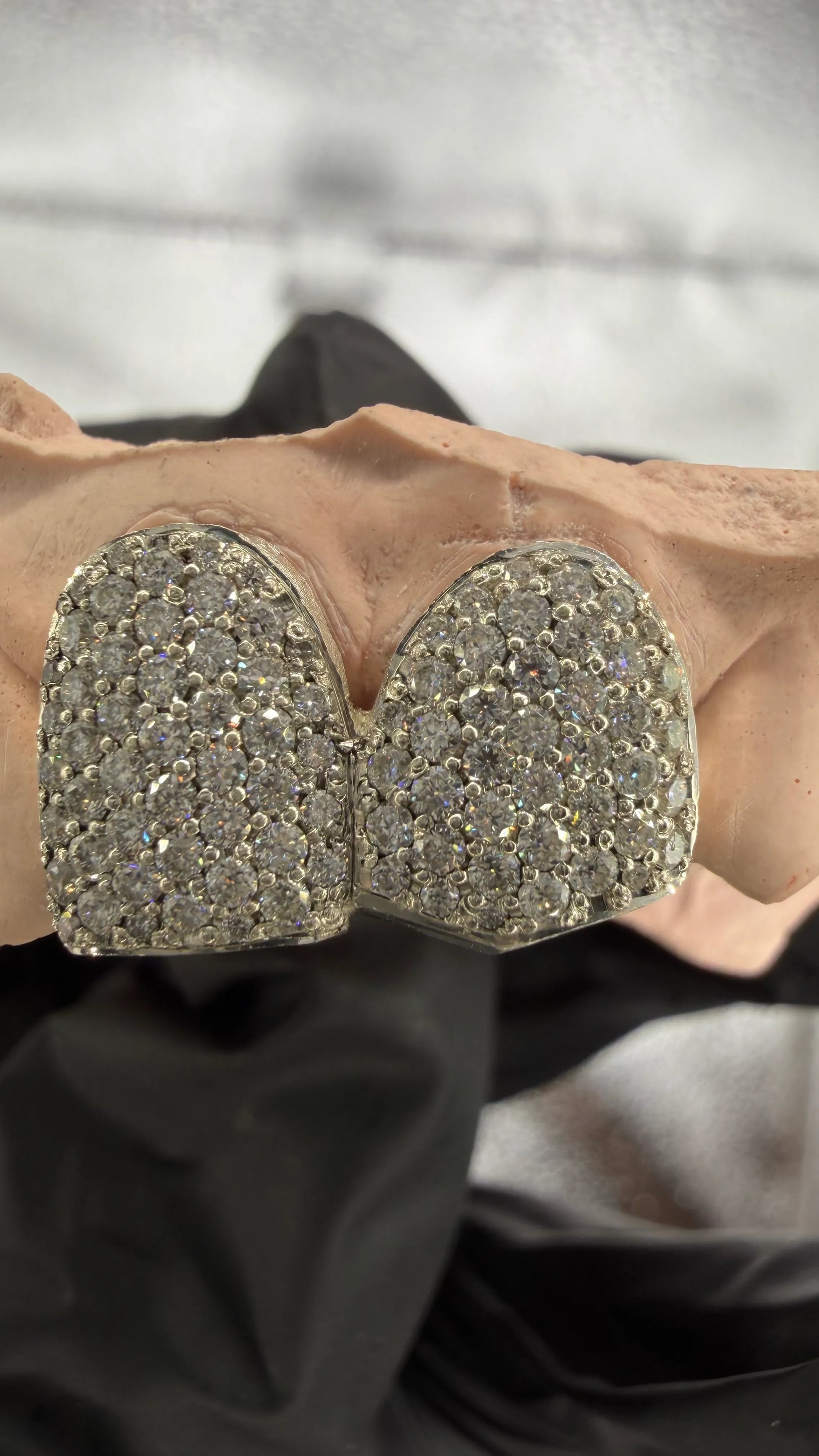Zoom angled view of custom iced out grillz with VVS moissanite stones