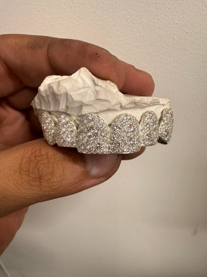 Luxury moissanite mosaic set grillz displayed on dental mold