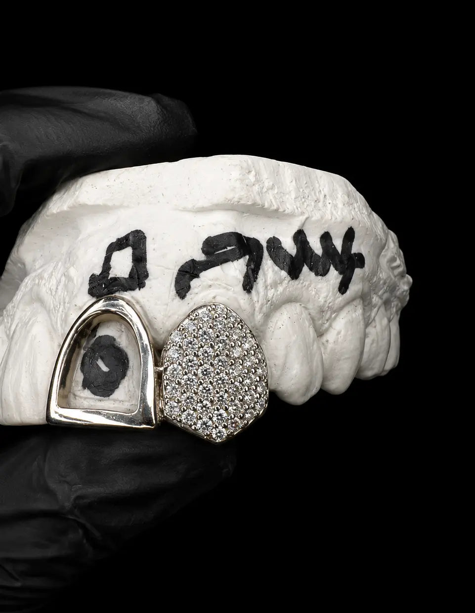 Custom double grillz set with VVS lab diamonds displayed on black background with luxury studio lighting