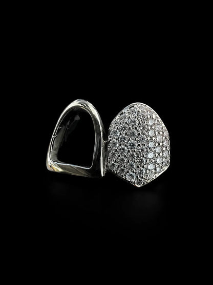 Close up of iced out VVS lab diamond grillz with pavé detailing and polished finish