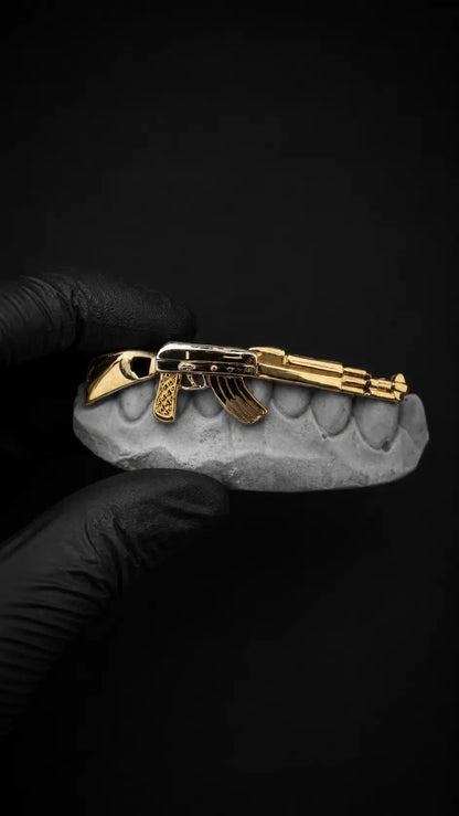 Luxury AK-47 custom fit grillz handcrafted in solid gold and silver with polished finish
