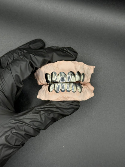 Extreme close-up of handmade luxury grillz showing detailed craftsmanship