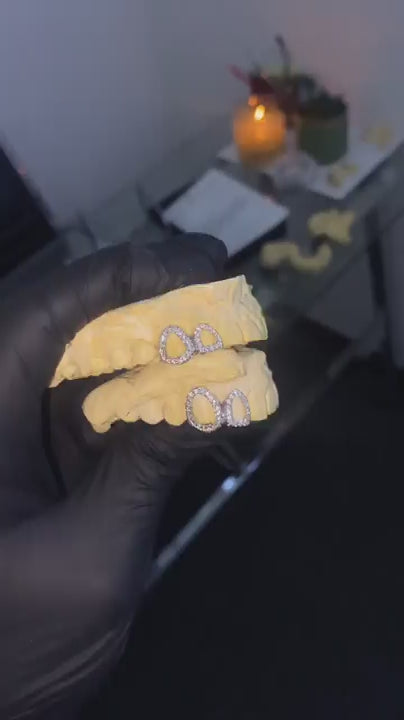 Video showcasing open window iced out custom grillz with VVS lab grown diamonds