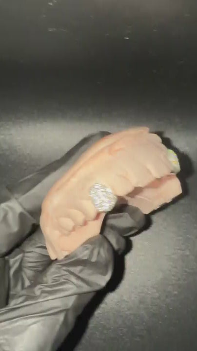 Rotating view of single cap custom grillz with moissanite stones