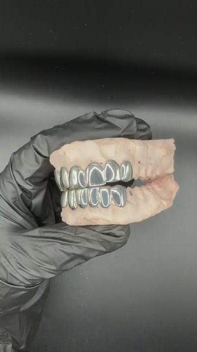 Close-up of handmade custom grillz showing precision fit and polished finish