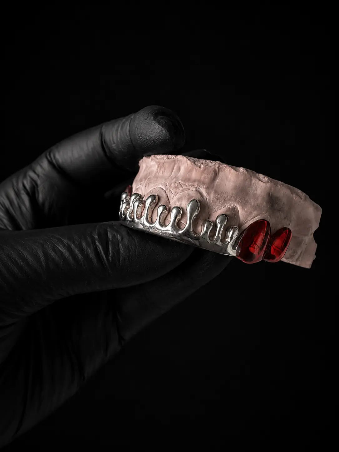 Luxury custom sterling silver grillz with handcrafted dripped design and red plated details
