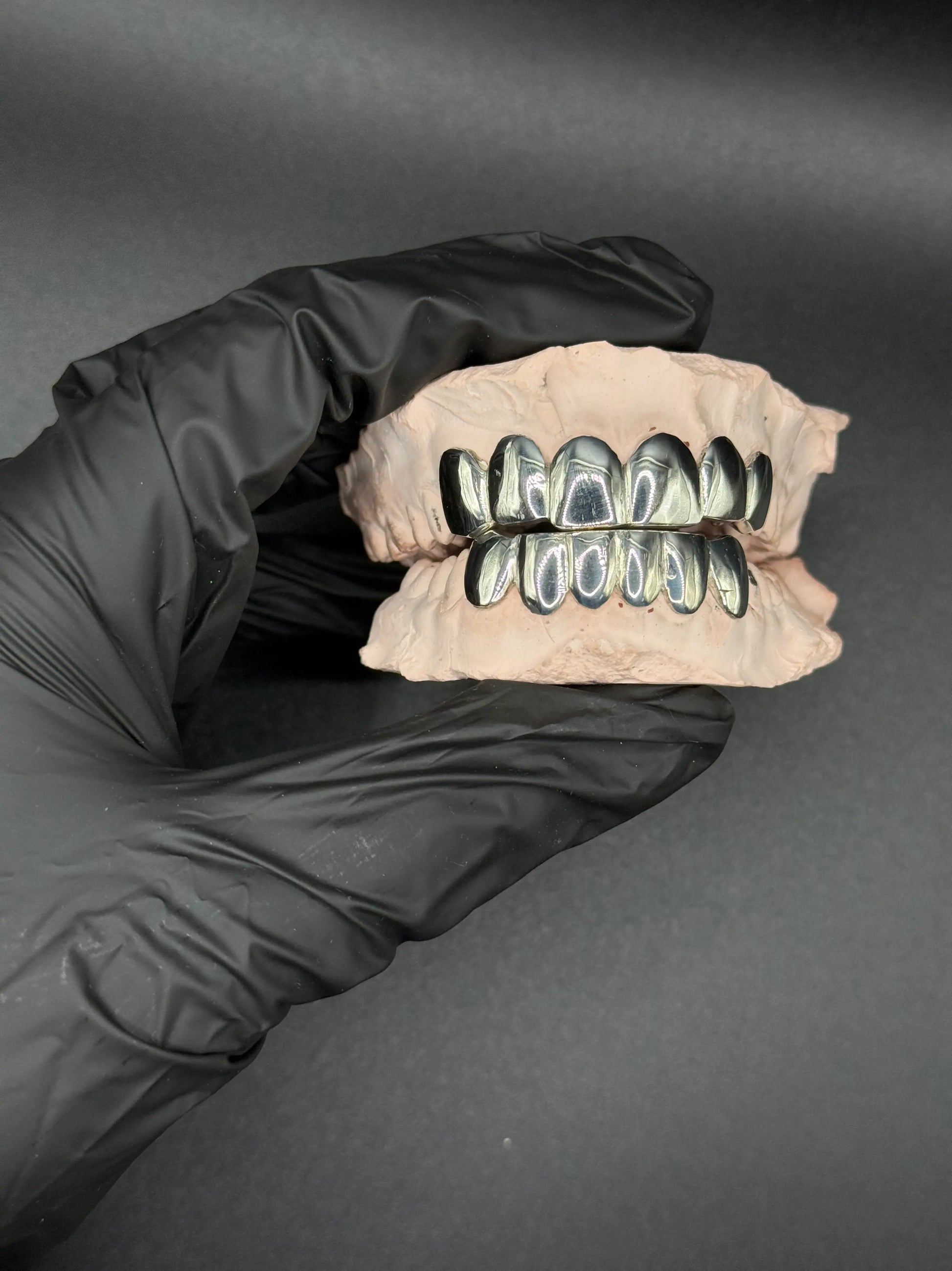 Custom handmade solid gold grillz with smooth luxury finish