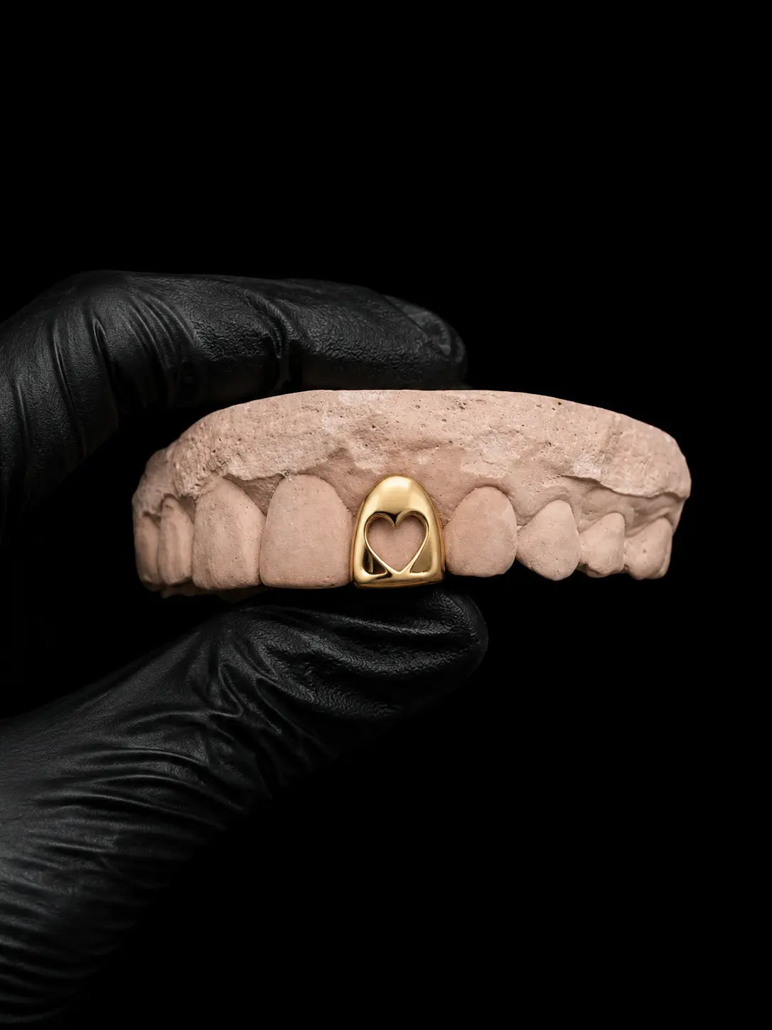 Handmade solid gold hollow heart tooth cap grillz with polished finish